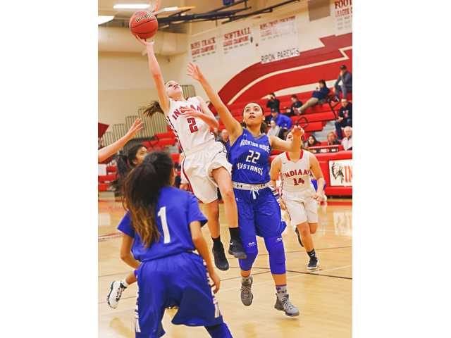 RHS point guard Reina Sausedo (2) shows why she is one of TVLs MVPs.  Photo by Manteca Bulletin. 