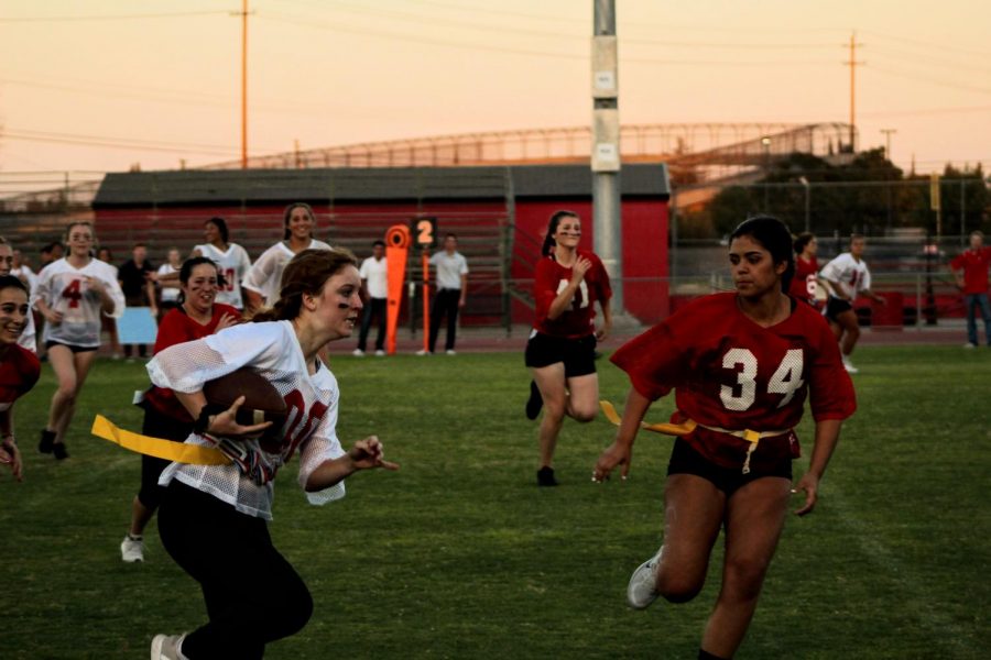 Gianna Brocchini runs for a touchdown as Madison Rodriguez tries to block her.