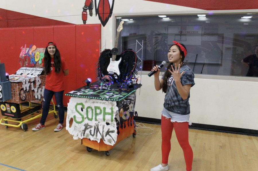 Sophomore class president, Niki Nguyen, explaining to the student body why the sophomores shopping cart is the best.