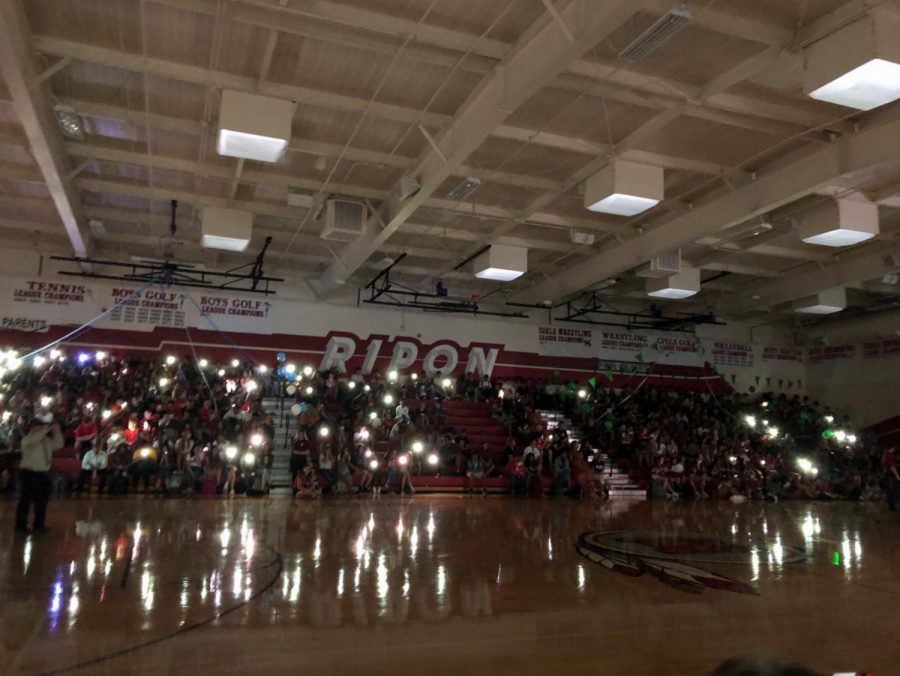 Ripon High shows their pride by flashing lights together waiting for the announcement of the homecoming theme.