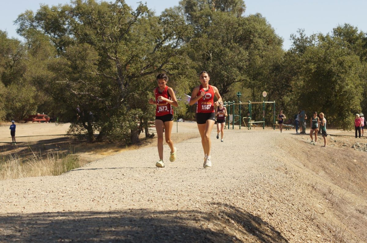 Sophomore Ailin Delgado Rodriguez and freshman Noeli Jimenez running together