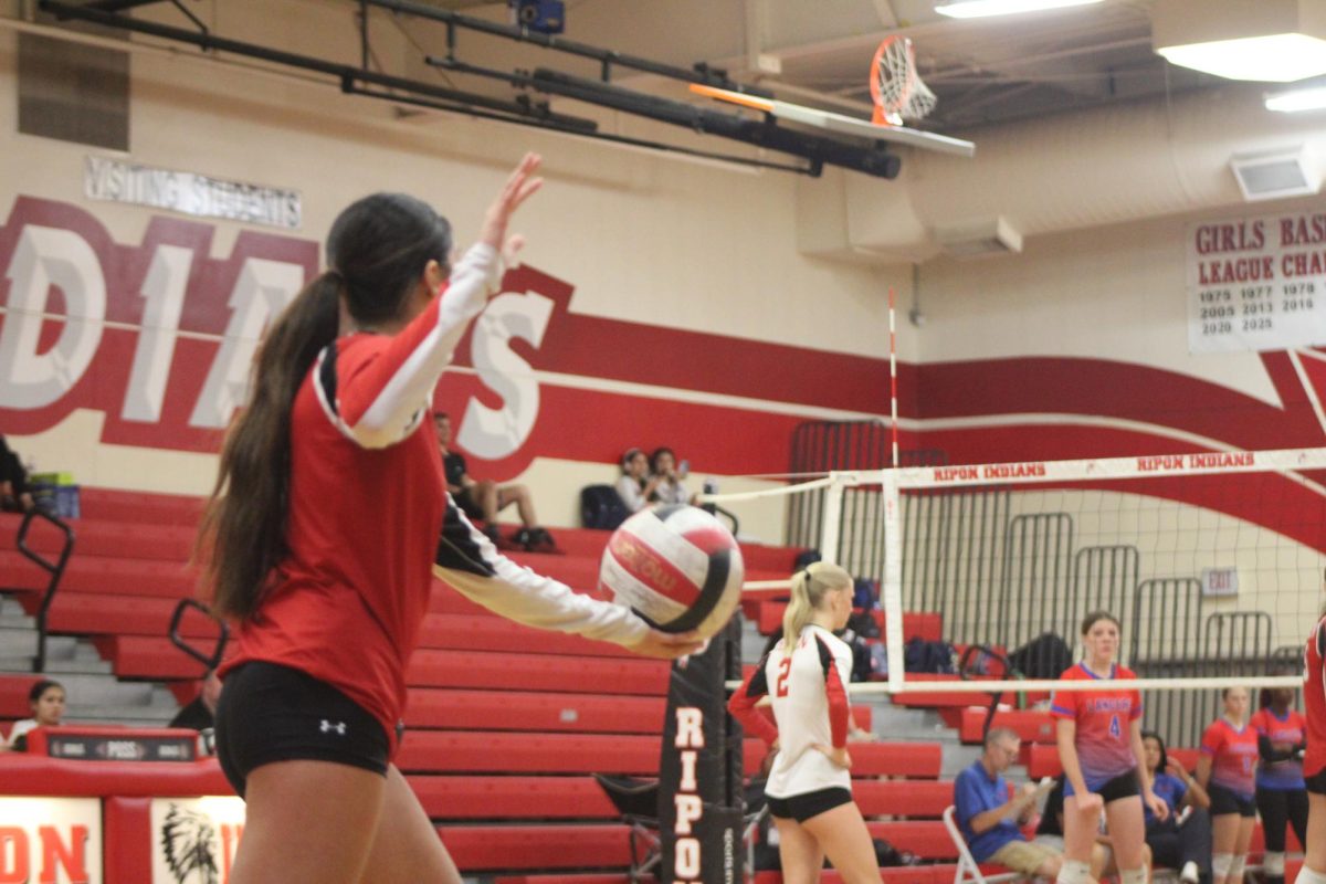Junior Jazmin Gonzalez serving for the Indians