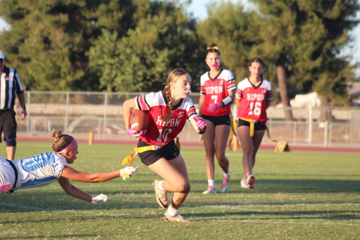 Tough Defeat for Girls' Flag Football Team After Hard-Fought Battle