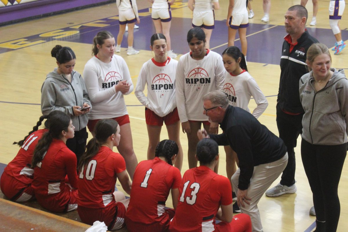 Drive and Determination: Girls Basketball Claims League Win