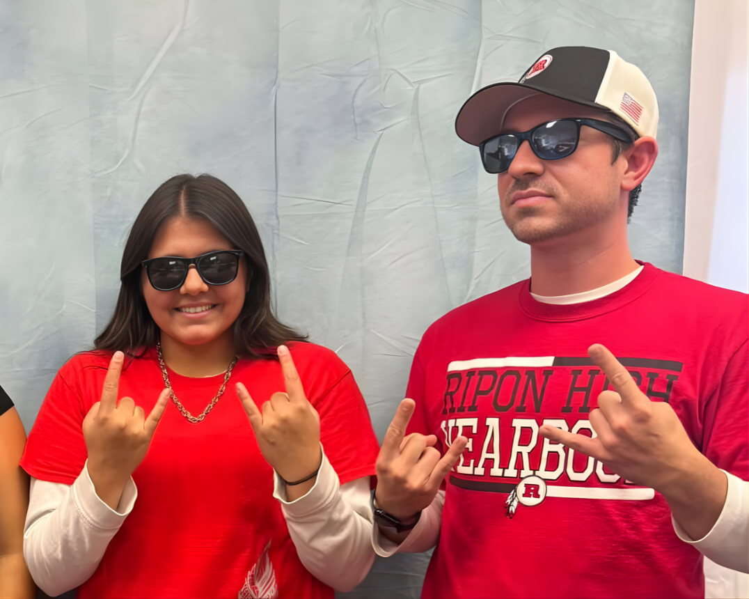 Chloe Hager (left) beside Mr. Sikma (right)